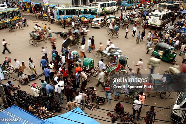People shop at an afternoon market on July 19, 2008 in Dhaka, Bangladesh. According to a recent World Bank study, Bangladesh is among at least 33...
