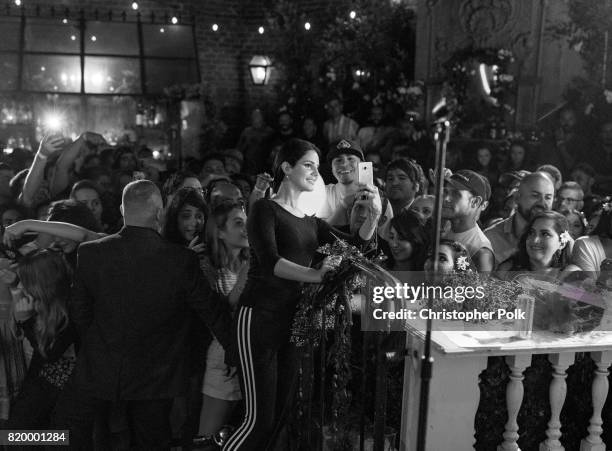 Singer-songwriter Lana Del Rey takes a selfie with a fan during a Spotify event of her new album, "Lust For Life," at No Vacancy on July 20, 2017 in...