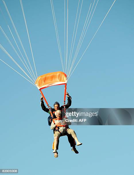 Alice Delfine performs a 2500 m freefall parachute jump with her skydiver instructor on July 19, 2008 at Gap-Tallard aerodrome, southern France. AFP...