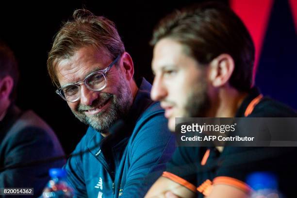 Liverpool manager Jurgen Klopp and player Adam Lallana attend a press conference of the Premier League Asia Trophy football tournament in Hong Kong...