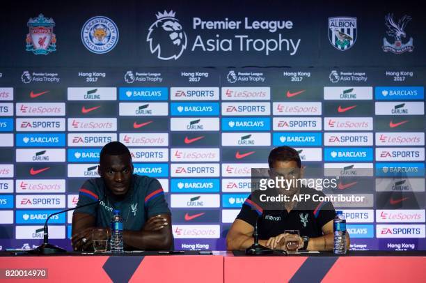 Crystal Palace manager Frank de Boer and player Christian Benteke attend a press conference of the Premier League Asia Trophy football tournament in...