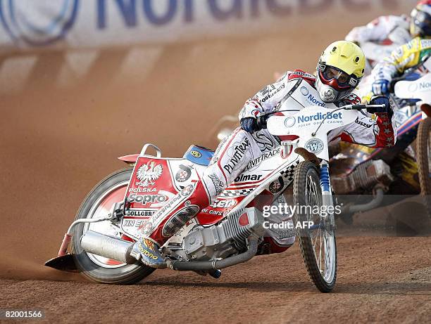 Tomasz Gollob of Poland leeds a heat on July 19 2008 in Vojens, western Denmark, during the Speedway World Cup final. The three other teams in the...