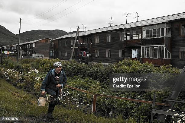 Woman walks in a village Esso in of Kamchatka peninsula August 2007in Russia