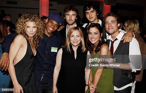 Cast members AnnaLynne McCord, Tristan Wilds, Ryan Eggold, Michael Steger, Jessica Stroup and Dustin Milligan pose with Dawn Ostroff, CW...