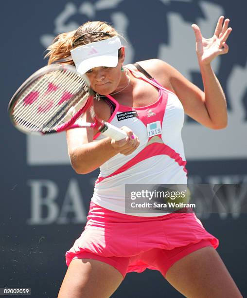 Aleksandra Wozniak of Canada returns a shot against Serena Williams of the USA during the semifinals at the Bank of the West Classic Day 6 at...