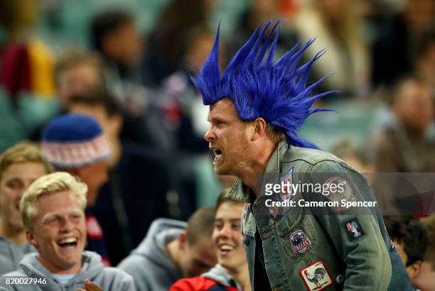 Fan cheers during the round 20 NRL match between the Sydney Roosters and the Newcastle Knights at Allianz Stadium on July 21, 2017 in Sydney,...