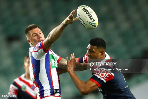 Shaun Kenny-Dowall of the Knights offloads the ball during the round 20 NRL match between the Sydney Roosters and the Newcastle Knights at Allianz...