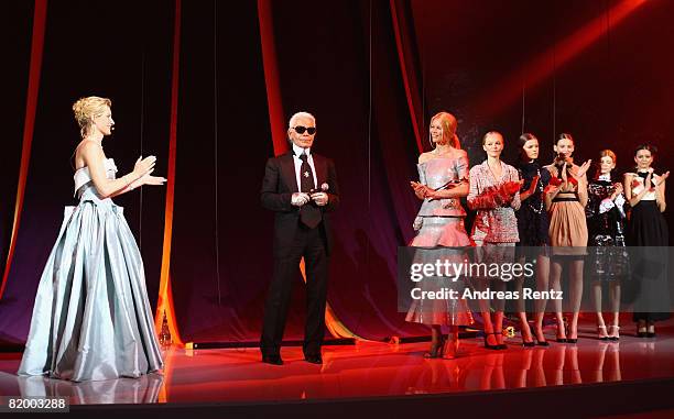 Karl Lagerfeld attends the ELLE Fashion Star award ceremony accompanied by Claudia Schiffer and Maria Furtwaengler during Mercedes Benz Fashion week...