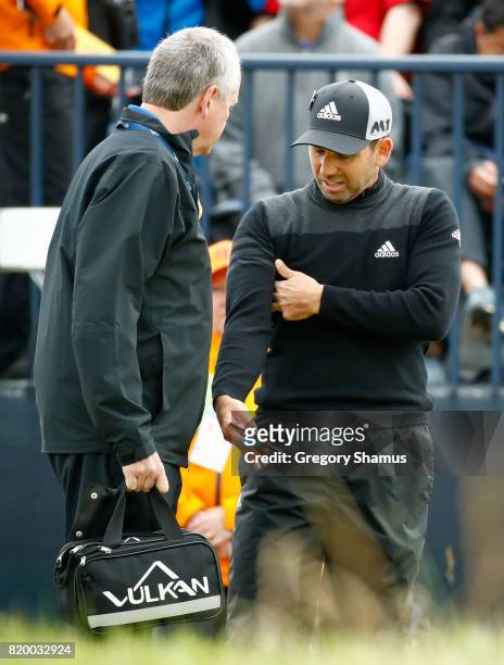 Sergio Garcia of Spain talks to the physio on the 7th tee during the second round of the 146th Open Championship at Royal Birkdale on July 21, 2017...