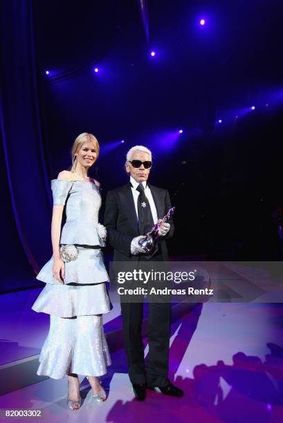 Claudia Schiffer presents Karl Lagerfeld with a 'Platinum' lifetime achievement award at the ELLE Fashion Star award ceremony during Mercedes Benz...