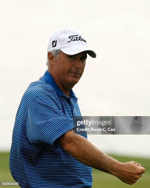Curtis Strange reacts after sinking a birdie putt on the 14th green during the second round of the 2008 3M Championship at TPC Twin Cities on...