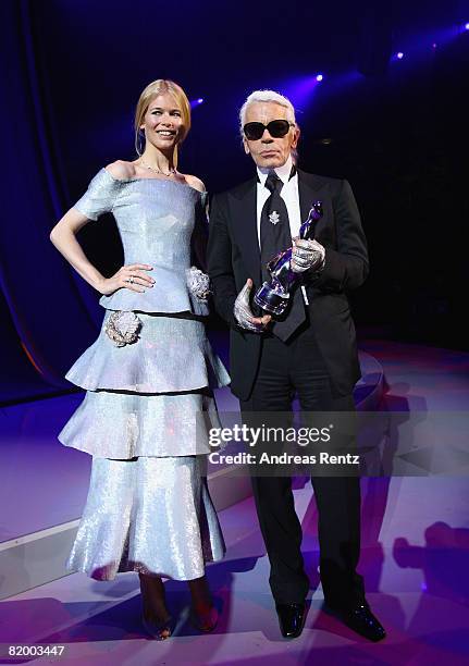 Claudia Schiffer presents Karl Lagerfeld with a lifetime achievement award at the ELLE Fashion Star award ceremony during Mercedes Benz Fashion week...