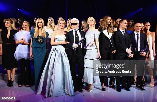 Karl Lagerfeld stands with Maria Furtwaengler and Claudia Schiffer at the ELLE Fashion Star award ceremony during Mercedes Benz Fashion week...