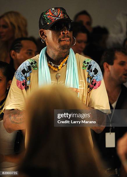 Former NBA Player Dennis Rodman watches the Ed Hardy Swimwear 2009 collection fashion show during Mercedes-Benz Fashion Week Swim at the Raleigh...
