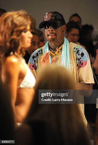 Former NBA Player Dennis Rodman watches the Ed Hardy Swimwear 2009 collection fashion show during Mercedes-Benz Fashion Week Swim at the Raleigh...