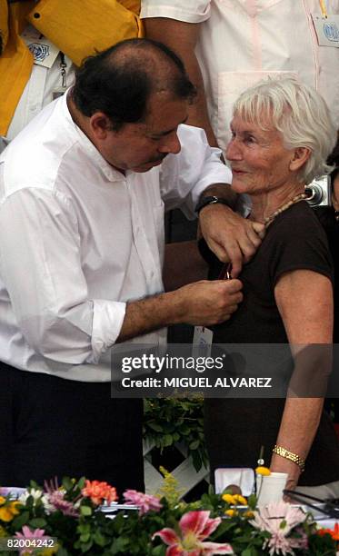 Margot Honecker , the widow of the former head of East Germany, Erich Honecker , is honoured by Nicaragua's President, Daniel Ortega , during a...