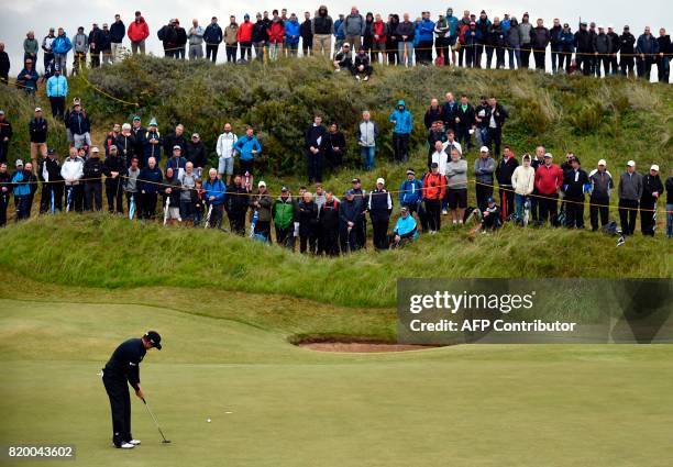 Golfer Zach Johnson putts on the 2nd green during his second round on day two of the Open Golf Championship at Royal Birkdale golf course near...