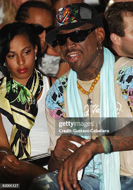 Former NBA player Dennis Rodman watches Ed Hardy Swimwear 2009 collection fashion show during Mercedes-Benz Fashion Week Swim at the Raleigh Hotel on...