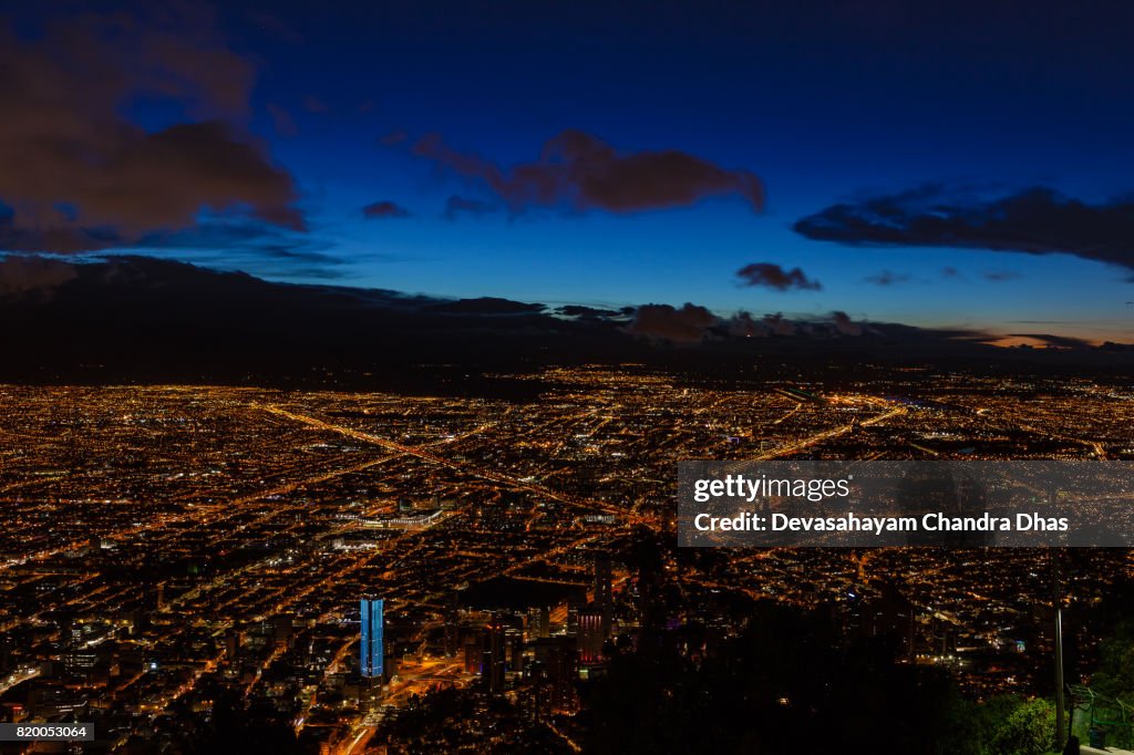 Bogota, Colombia: Striking High Angle View Of The Capital City On The Altiplano From The Andes Peak Of Monserrate after Sunset