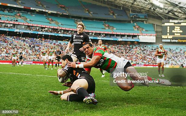 Taniela Tuiaki of the Tigers scores in the corner during the round 19 NRL match between the South Sydney Rabbitohs and the Wests Tigers at ANZ...