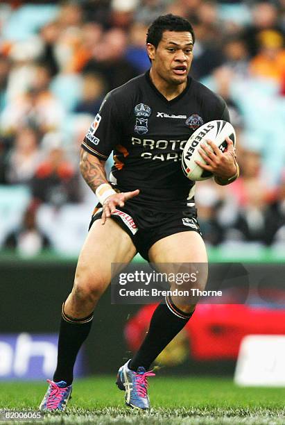 Taniela Tuiaki of the Tigers runs with the ball during the round 19 NRL match between the South Sydney Rabbitohs and the Wests Tigers at ANZ Stadium...