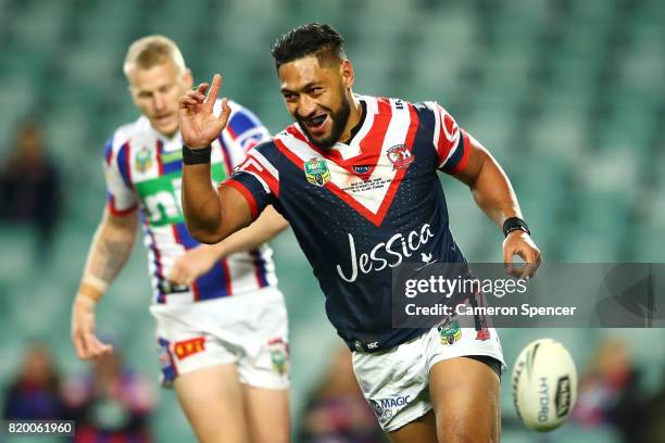 Isaac Liu of the Roosters celebrates scoring a try during the round 20 NRL match between the Sydney Roosters and the Newcastle Knights at Allianz...