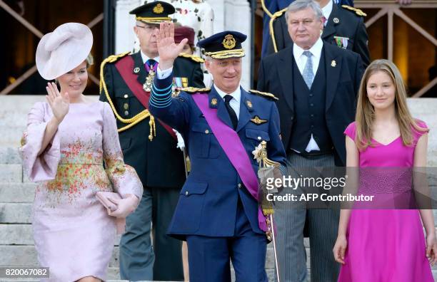 Queen Mathilde of Belgium, King Philippe of Belgium and Crown Princess Elisabeth walk after the Te Deum Mass at The Saint Michael and St Gudula...