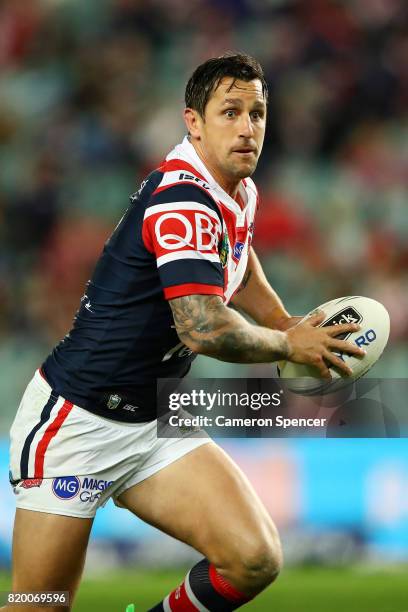 Mitchell Pearce of the Roosters runs the ball during the round 20 NRL match between the Sydney Roosters and the Newcastle Knights at Allianz Stadium...