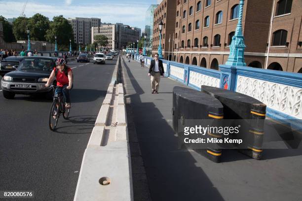 Security barricades placed on the pavement blocking Tower Bridge from any potential terror attack in London, England, United Kingdom. Following...