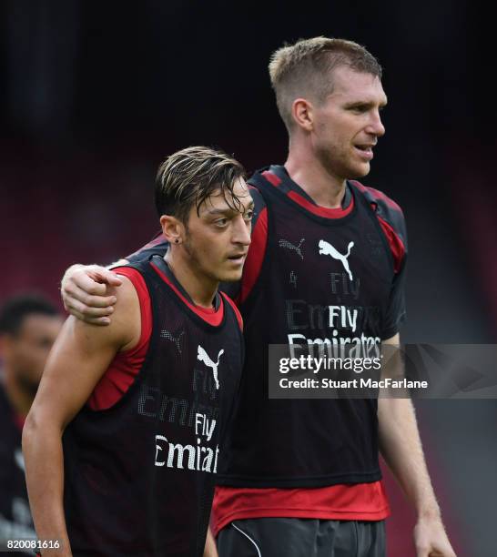 Mesut Ozil and Per Mertesacker of Arsenal during a training session at the Birds Nest stadium on July 21, 2017 in Beijing, China.