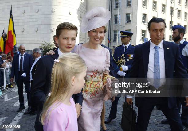 Princess Eleonore, Prince Gabriel and Queen Mathilde of Belgium walk after the Te Deum mass, at the Cathedral of St Michael and St Gudula in...