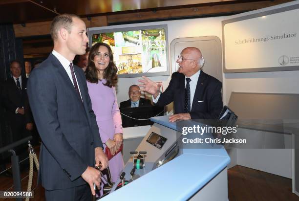 Prince William, Duke of Cambridge and Catherine, Duchess of Cambridge are shown a shipping container simulator as they visit the Maritime Museum to...