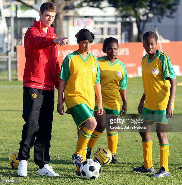 Jonny Evans of Manchester United in action during a visit to a Township Soccer League at Ajax Stadium , as part of their pre-season tour to South...