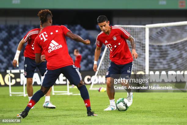 James Rodriguez of FC Bayern Muenchen battles for the ball during a training session at Shenzhen Universiade Sports Centre during the Audi Summer...