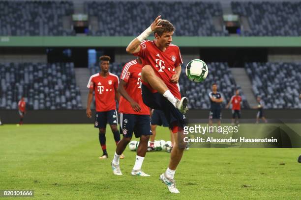 Thomas Mueller of FC Bayern Muenchen battles for the ball during a training session at Shenzhen Universiade Sports Centre during the Audi Summer Tour...