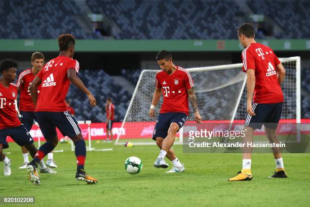 David Alaba of FC Bayern Muenchen battle for the ball with his team mates Thomas Mueller, Kinglsey Coman, James Rodriquez and Robert Lewandowski...
