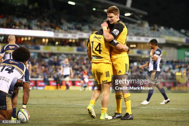 Wes Goosen of the Hurricanes is congratulated by team mate Jordie Barrett after he scored during the Super Rugby Quarter Final match between the...
