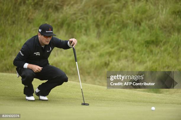Golfer Zach Johnson lines up a putt on the 6th green during his second round on day two of the Open Golf Championship at Royal Birkdale golf course...