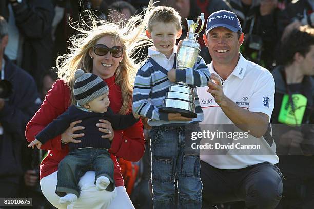 Padraig Harrington of the Republic of Ireland celebrates with the Claret Jug with wife Caroline and sons Patrick and Ciaran after winning by 4...