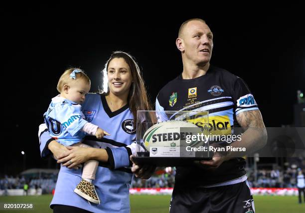 Luke Lewis of the Sharks celebrates after his 300th NRL match during the round 20 NRL match between the Cronulla Sharks and the South Sydney...