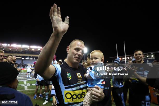 Luke Lewis of the Sharks celebrates after his 300th NRL match during the round 20 NRL match between the Cronulla Sharks and the South Sydney...