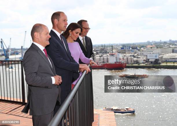 Britain's Prince William , Duke of Cambridge, his wife Kate, the Duchess of Cambridge , and the Mayor of Hamburg Olaf Scholz look at the city from a...