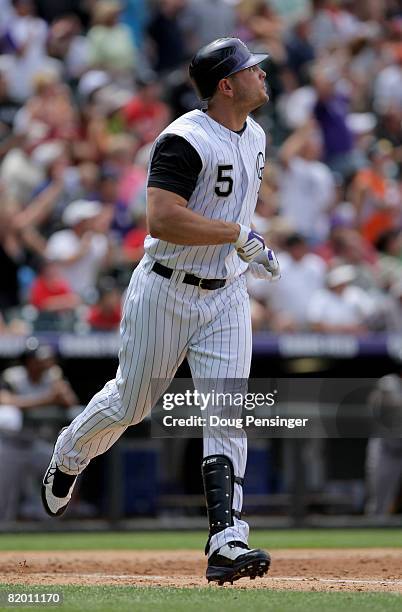 Matt Holliday of the Colorado Rockies watches his solo homerun off of starting pitcher Zach Duke of the Pittsburgh Pirates to give the Rockies 6-3...