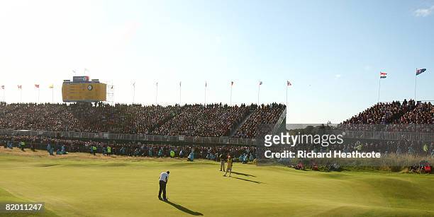Padraig Harrington of the Republic of Ireland putts on the 18th green to take a 4 stroke victory during the final round of the 137th Open...