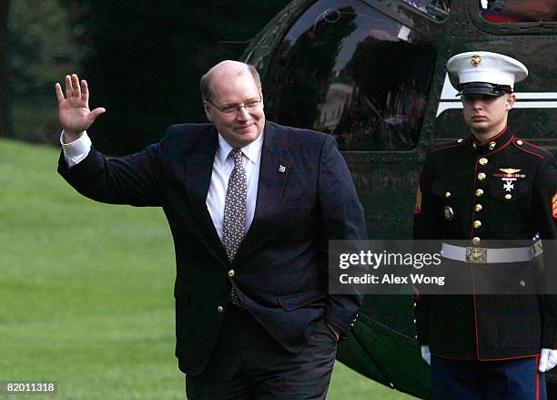 White House Deputy Chief of Staff Joe Hagin waves after he returned to the White House from Crawford, Texas, with U.S. President George W. Bush and...