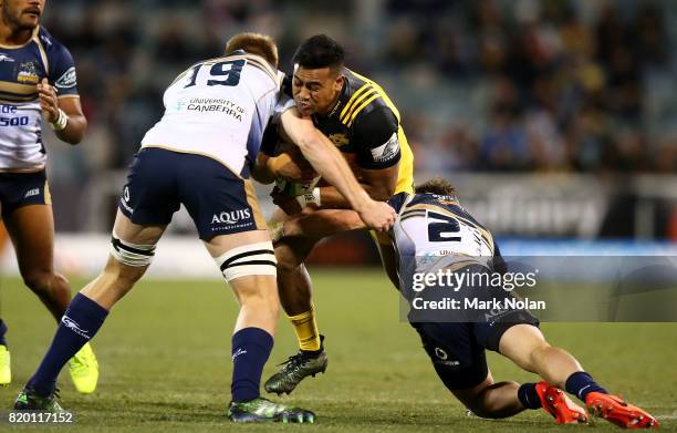 Julian Savea of the Hurricanes is tackled during the Super Rugby Quarter Final match between the Brumbies and the Hurricanes at Canberra Stadium on...