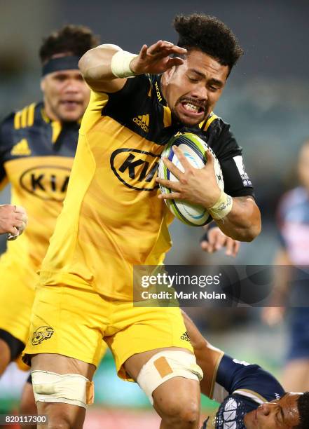 Ardie Savea of the Hurricanes is tackled during the Super Rugby Quarter Final match between the Brumbies and the Hurricanes at Canberra Stadium on...