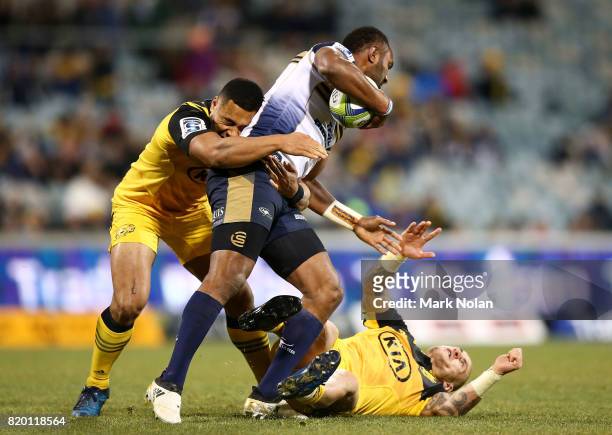 Tevita Kuridrani of the Brumbies collides with TJ Perenara of the Hurricanes during the Super Rugby Quarter Final match between the Brumbies and the...