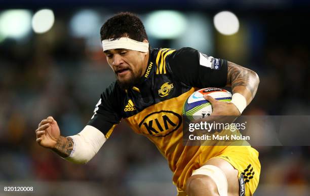 Vaea Fifita of the Hurricanes runs the ball during the Super Rugby Quarter Final match between the Brumbies and the Hurricanes at Canberra Stadium on...