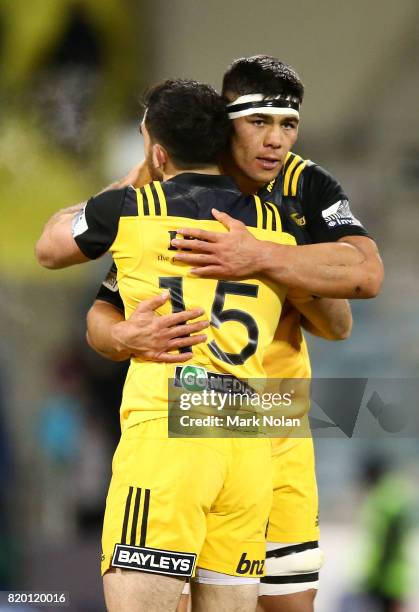 Nehe Milner-Skudder and Reed Prinsep of the Hurricanes embrace after winning the Super Rugby Quarter Final match between the Brumbies and the...